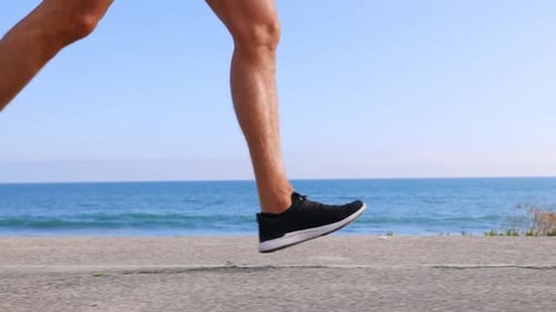 Athletic Man Exercising At The Beach
