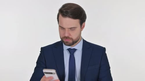 Businessman Talking on Phone in Suit