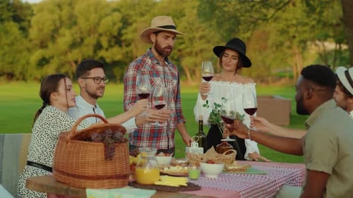 Enjoy a Delightful Outdoor Gathering with Close Friends While Celebrating with Wine and Laughter