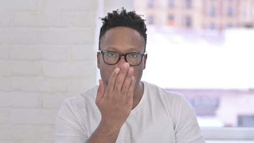 Young Adult Gesturing Kiss with a Smile