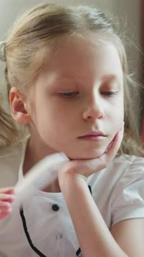 Young Girl Looking Down with Numbers