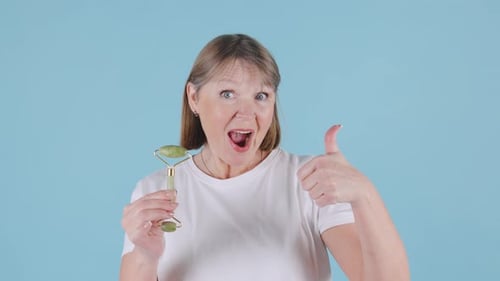 Woman Promoting Jade Roller for Skin Care