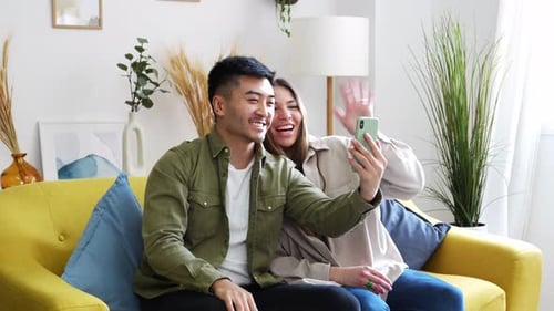Multiracial Couple Using Mobile Phone for Video Call