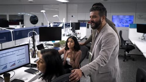 Business People Talking Meeting At Desk In Open Plan Office Slow Motion