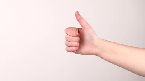 A thumbs up changing into a thumbs down on a white background.
