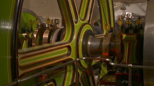 Vintage Engine Wheel Rotating in Green Machine