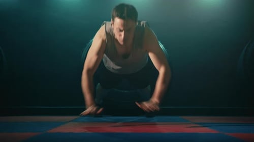 Man Doing Push-Ups at the Gym