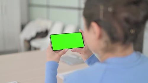 Indian Woman Holding Smartphone with Chroma Key Screen