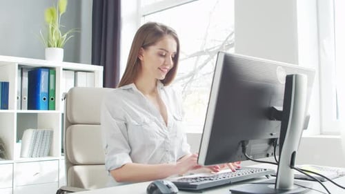 Young Woman Works at Office Using Computer Workplace of Entrepreneur Manager or Businesswoman Remote
