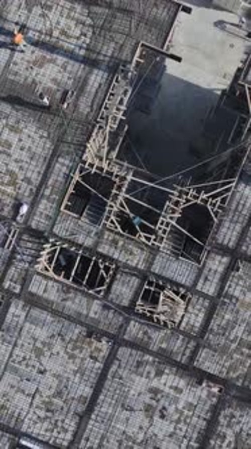 Vertical Video Concrete Pouring and Teamwork at a Residential Building Construction Site