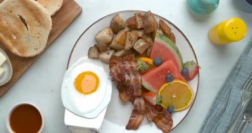 Delicious Breakfast Plate Overhead with Egg, Bacon, and Potatoes