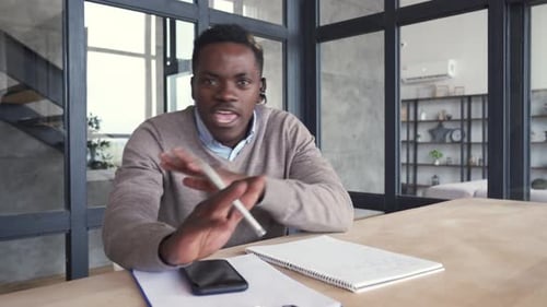 Enthusiastic Man Explaining Concept During Video Call
