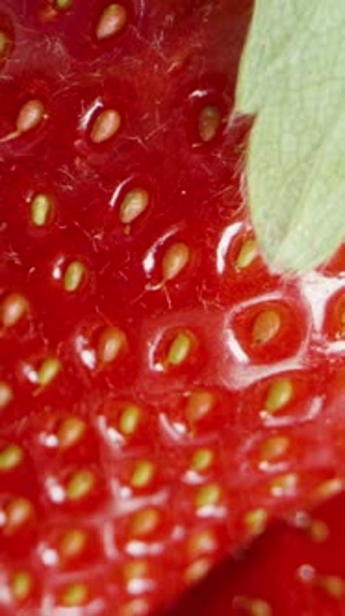 Vertical video. Fresh Strawberry, Top-View Dolly Shot. Close-Up.