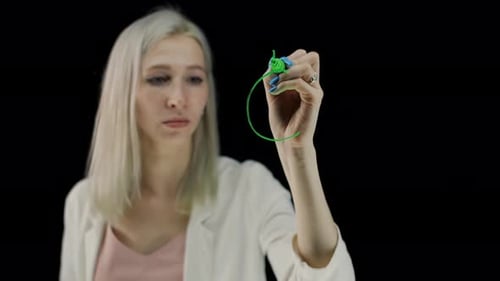 A Currency Sign Inscribed with a Green Marker on a Dark Background
