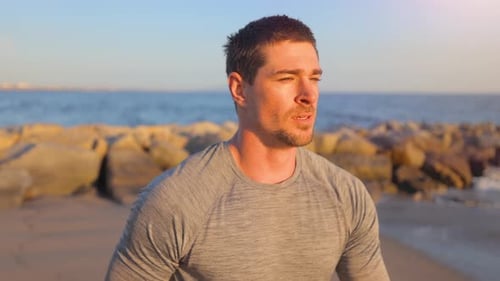 Athletic Man Exercising At The Beach