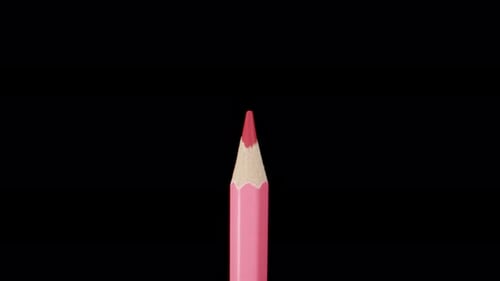 Crayon rose sur fond noir, grossissement. Dolly Slider en très gros plan. Sonde Laowa