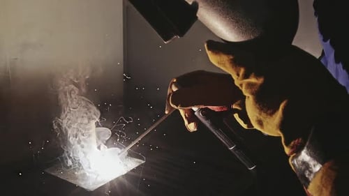Worker Wearing Safety Visor Doing Metal Welding