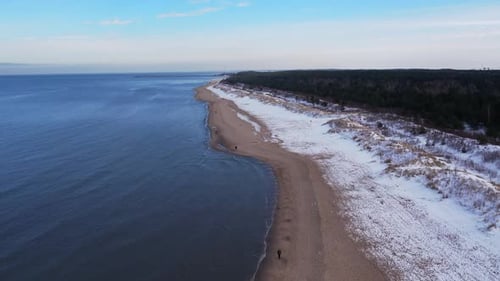 Winter in Cold Baltic Sea Snowy Beach in Gdansk Aerial View of Snow Covered Beach and Dunes Dark