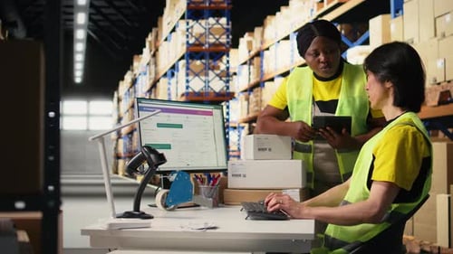 Depot Coworkers Processing Orders and Preparing the Packages Together