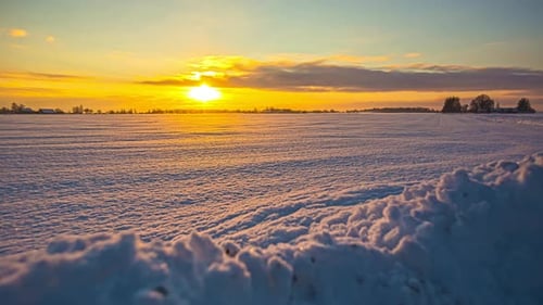 Golden Sunrise Over Snowy Winter Field