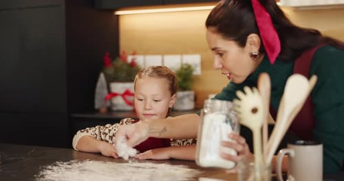 Happy, baking and mother with kid in kitchen for learning, bonding or cooking together in home