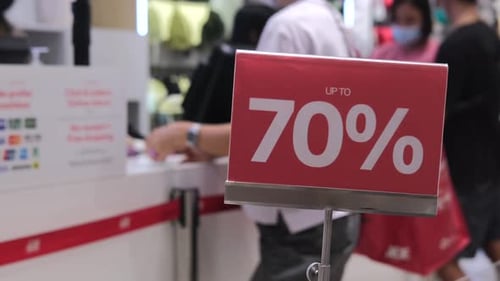 Retail Checkout with 70% Off Sale Sign