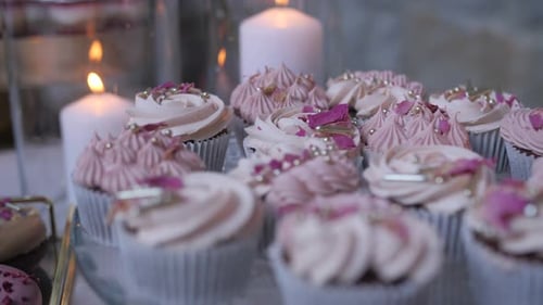 Elegant Cupcakes Decorated with Pink Frosting and Roses