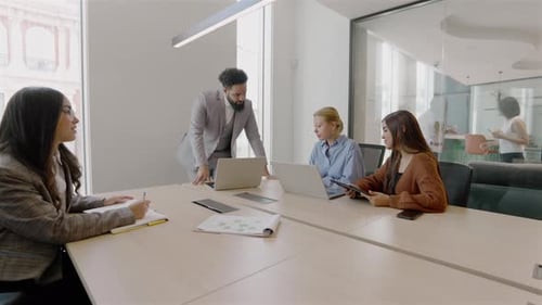 A Diverse Team Engaged in Active Collaboration Within a Modern Innovative Office Space