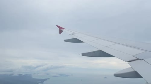 Sky from airplane with wing fly over cloud in summer daytime