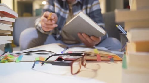 Student Studying Books at Desk in Home