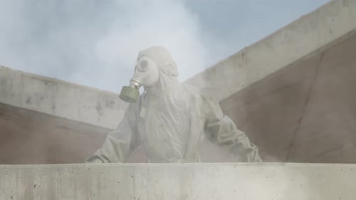 Hazmat Suited Figure in Smoky Post-Apocalyptic Urban Scene