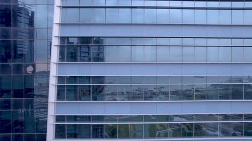 View of the empty office building windows during the day.