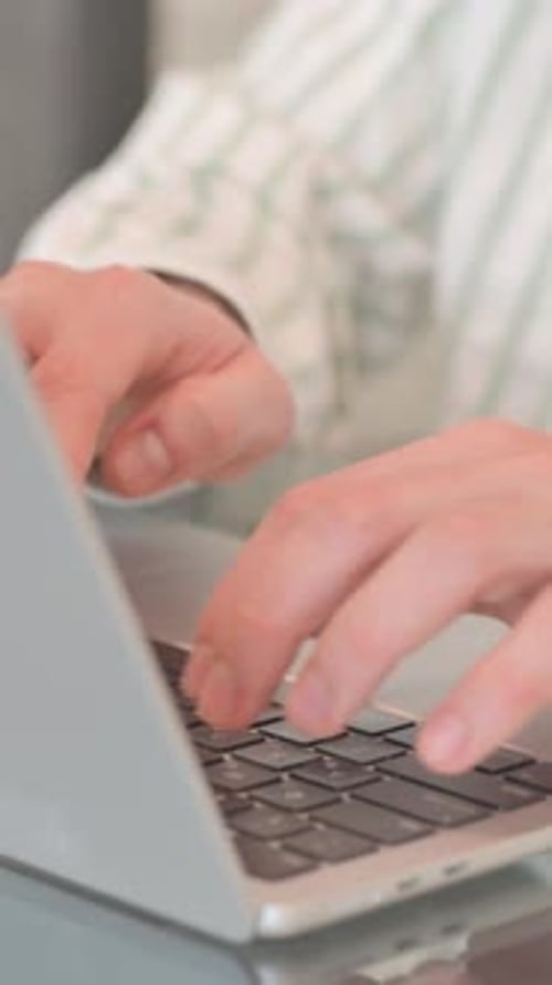 Close up of Hands Typing on Laptop, vertical video