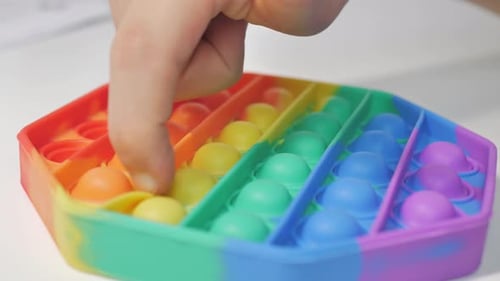 Hand Popping Rainbow Colored Hexagon Pop It Toy