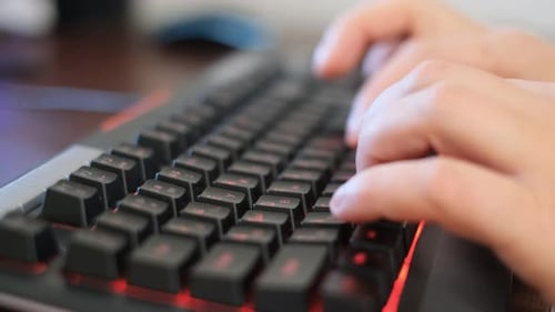 Closeup of Typing on Laptop or Computer Keyboard to Send Email and Browse Web Browser