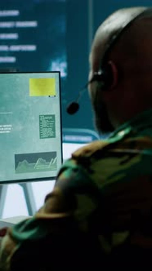 Vertical Video Military Personnel in Base of Operations Using Advanced Computers and Big Screen