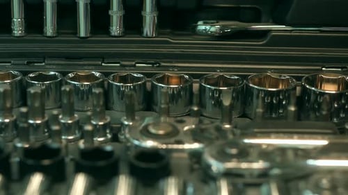 Silver Metal Tools in Black Toolbox Close Up
