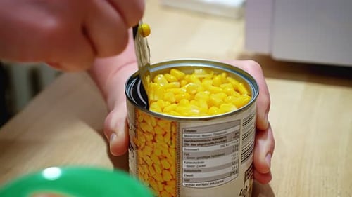 Opening a Can of Corn with a Spoon