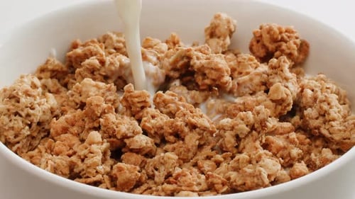 Milk Pouring into a Bowl of Cereal