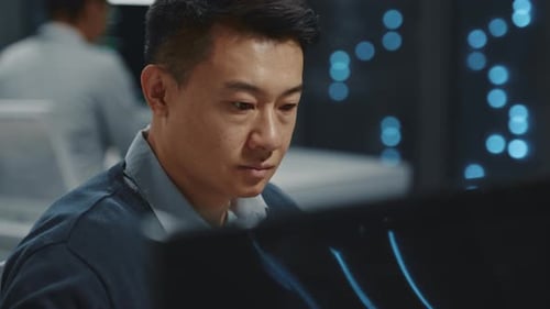 Chinese IT Administrator Performing Server Data Cloud Computing Backup Operation and Collaboration