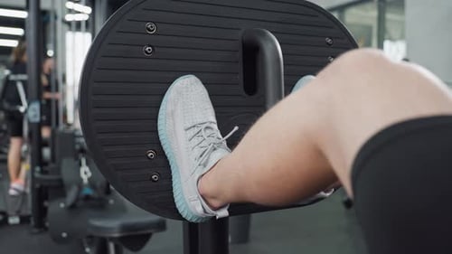 Gym Enthusiast Performing Leg Press To Engage Quadriceps And Glutes