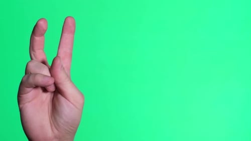 Fingers Up Gesture on a Green Background Male Hand Reaching Up and Gesturing