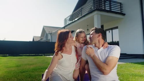 Happy Family Enjoying Time Together in Their Backyard