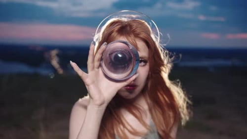 Enchanting Woman Gazing Through Crystal Ball at Sunset