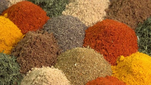 Spice and seasoning. Various fragrant spice market. Heap different Asian Spices rotated on wooden