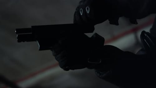 Closeup Soldier in Uniform Putting Magazine in Gun. Male Sniper Loading