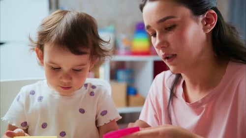 Mother and Child Play with Colorful Clay at Home