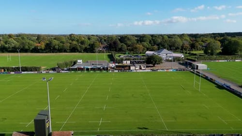 Aerial Cinematic View of Multi Field Rugby Complex and Clubhouse