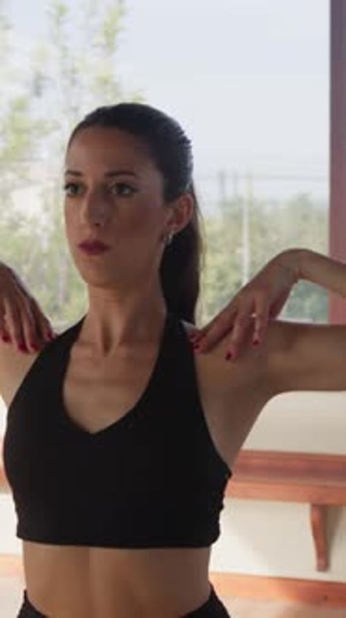 Ballerina Does Warm Up Exercises At Dance School