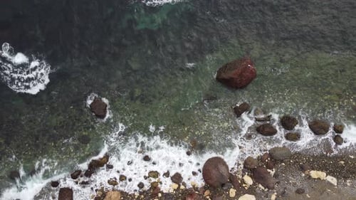 Aerial View on Calm Azure Sea and Volcanic Rocky Shores Small Waves on Water Surface Nature Summer